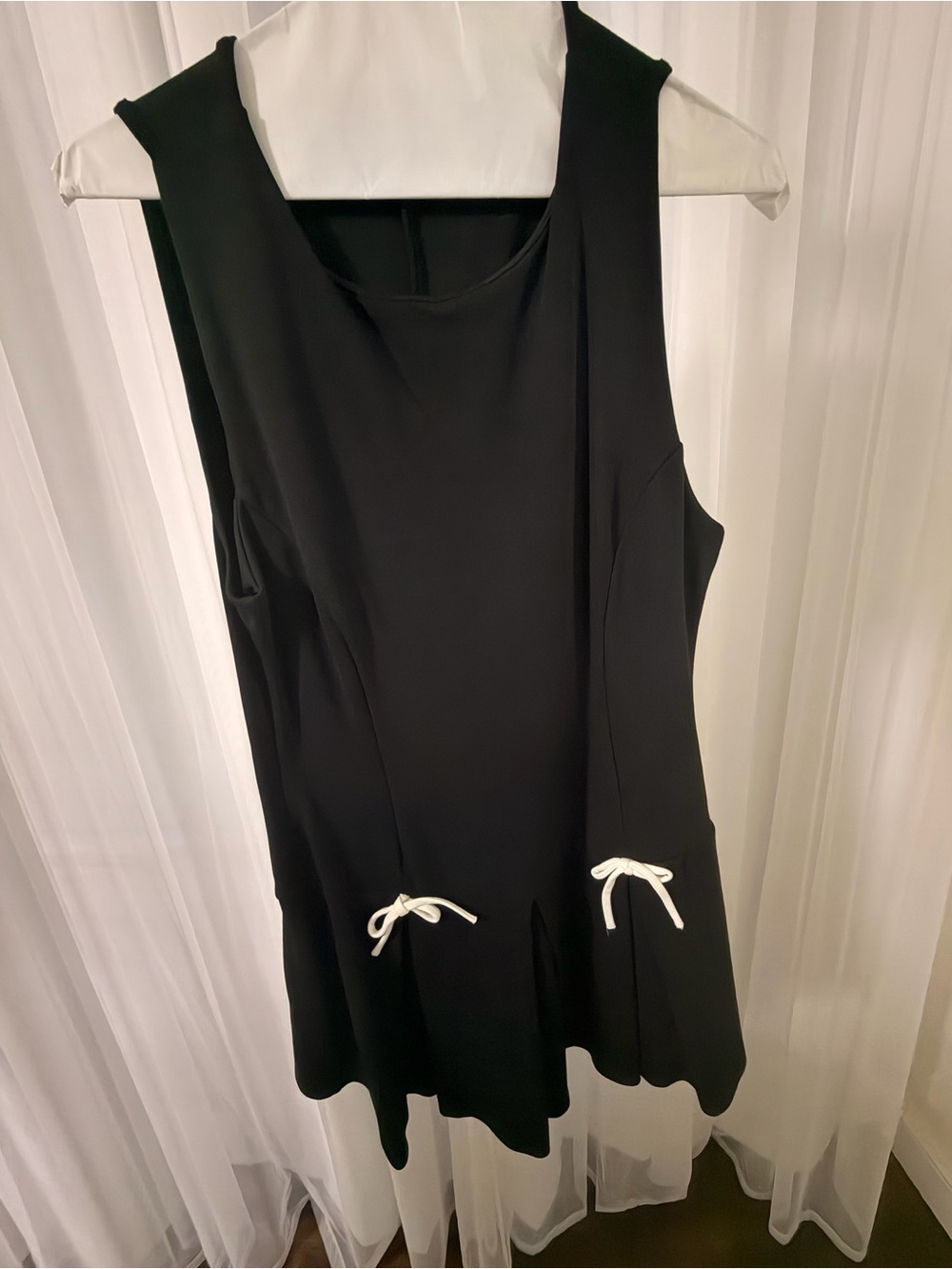 Black Sleeveless A-Line Dress with White Bow Details